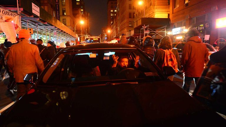 Protestors against the grand jury decision on the Eric Garner case march down Broadway Thursday Dec 4, 2014.