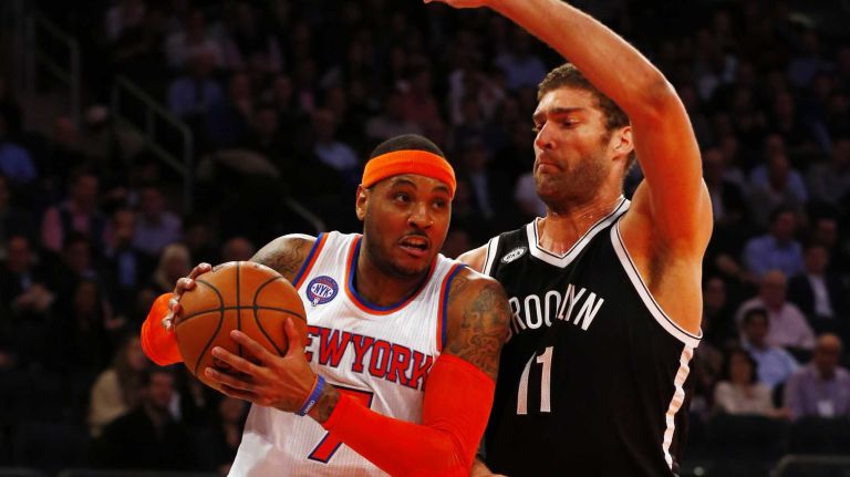 Knicks vs. Nets 24 Carmelo Anthony of the New York Knicks tries to drive to the hoop in the first half against Brook Lopez of the Brooklyn Nets at Madison Square Garden on Tuesday, Dec. 2, 2014.