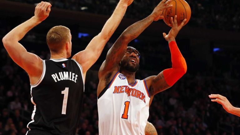 Knicks vs. Nets 26 Amar'e Stoudemire of the New York Knicks grabs a rebound against Mason Plumlee of the Brooklyn Nets at Madison Square Garden on Tuesday, Dec. 2, 2014.
