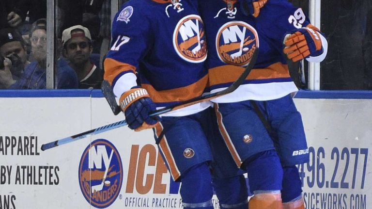 Islanders vs. Senators 35 New York Islanders center Brock Nelson, right, celebrates his goal with left wing Matt Martin against the Ottawa Senators in the second period of an NHL game at Nassau Coliseum on Tuesday, Dec. 2, 2014.