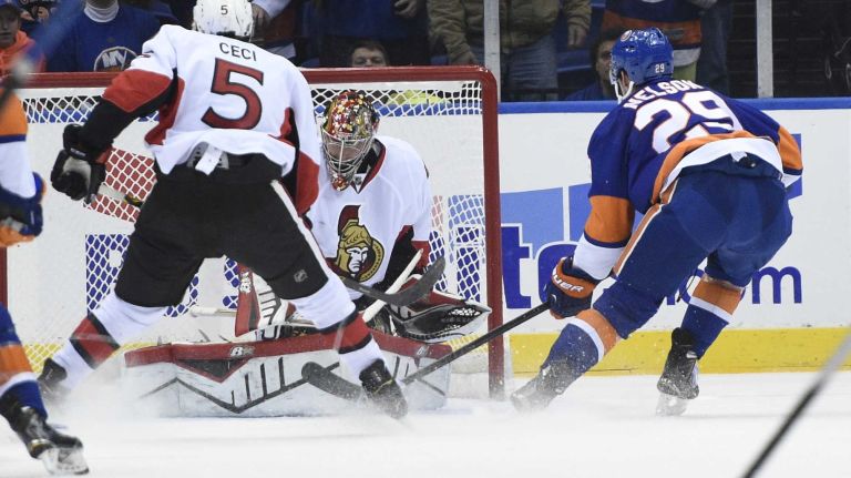 Islanders vs. Senators 36 New York Islanders center Brock Nelson scores on Ottawa Senators goalie Craig Anderson in the second period of an NHL game at Nassau Coliseum on Tuesday, Dec. 2, 2014.