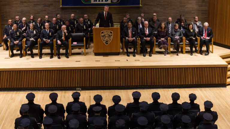 Mayor Bill de Blasio and Police Commissioner William J. Bratton preside over the New York Police Department ceremony at One Police Plaza in Manhattan on Friday, Dec. 19, 2014.