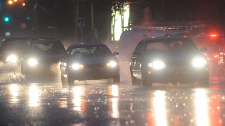 Nor'easter rain could cause flooding, messy commute; strong winds forecasted 2 Heavy rain falls as commuters navigate through slippery road conditions on Horseblock Road near Route 112 in Medford, Long Island, Tuesday morning, Dec. 9, 2014.