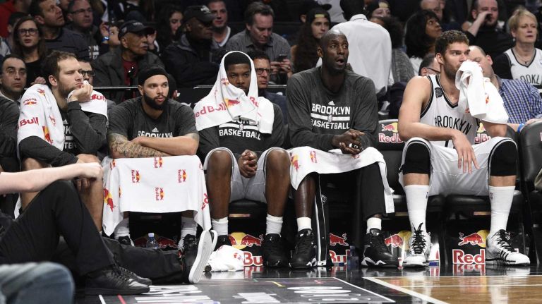 Brooklyn Nets guard Bojan Bogdanovic, guard Deron Williams, forward Joe Johnson, forward Kevin Garnett and center Brook Lopez look on from the bench in the third quarter against the Atlanta Hawks of an NBA basketball game at Barclays Center on Friday, December 5, 2014.  The Atlanta Hawks defeated the Brooklyn Nets 98-75.