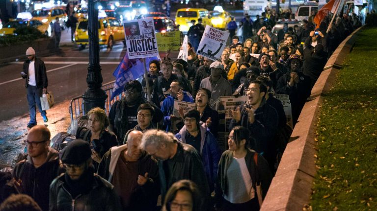 People gather at Union Square in Manhattan Monday, Nov. 24, 2014.