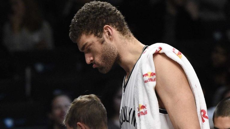 Brooklyn Nets center Brook Lopez goes to the bench after a timeout against the Atlanta Hawks in the second half of an NBA game at Barclays Center on Friday, Dec. 5, 2014.