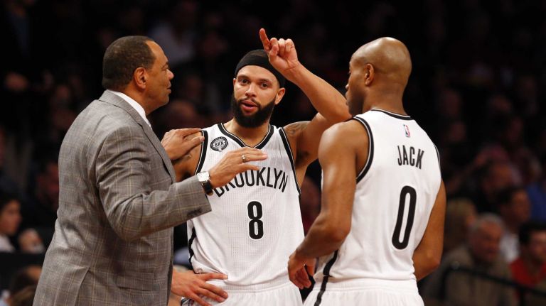 Head coach Lionel Hollins of the Brooklyn Nets talks with Deron Williams #8 and Jarrett Jack #0 during a game against the Cleveland Cavaliers at Barclays Center on Monday, Dec. 8, 2014.