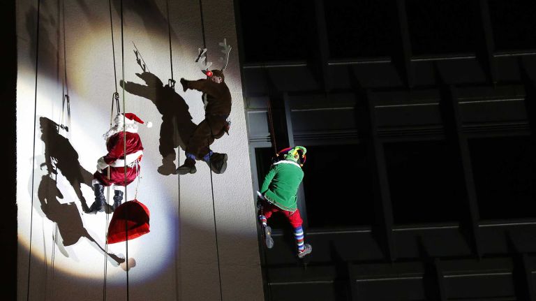Brian Cashman rappels down building 13 New York Yankees general manager Brian Cashman, dressed as Santa's helper, along with Santa and Rudolph the Red-Nosed Reindeer rappel off the Landmark Building on Dec. 7, 2014 in Stamford, Conn.