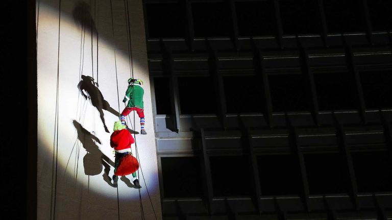 Brian Cashman rappels down building 16 New York Yankees general manager Brian Cashman, dressed as Santa's helper, and Santa rappel off the Landmark Building on Dec. 7, 2014 in Stamford, Conn.