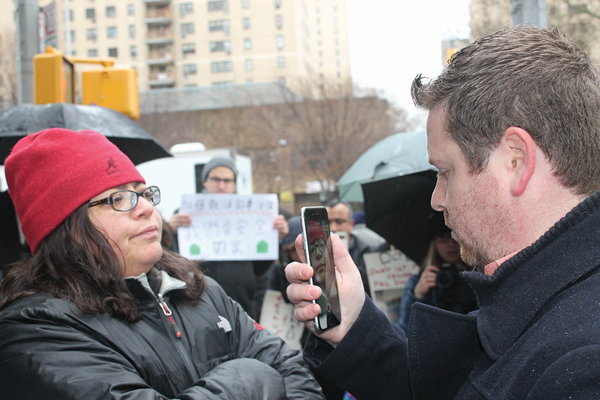 Councilmember Rosie Mendez blocked a representative of landlord Sammy Mahfer from videoing tenants at the press conference.