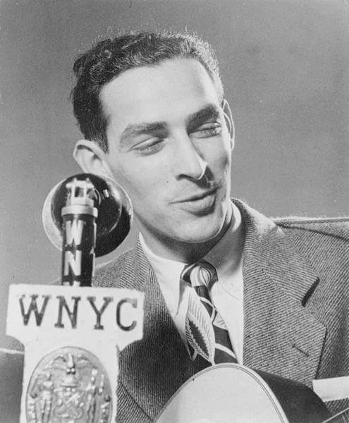 Oscar Brand: He’s still playing in the AM band 1 Oscar Brand strumming his guitar and singing on air on WNYC circa 1940s
