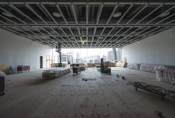 Still under construction when this photo was taken several months ago, this spacious, column-free main exhibit space features a large, floor-to-ceiling window on one wall that overlooks the Hudson River.   Photo by Tim Schenck