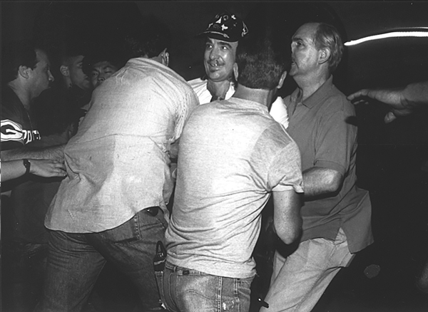 When police and protesters clashed on the L.E.S.; The cops won, but what were the lessons learned? 3 Clayton Patterson being swarmed and arrested by plainclothes police officers. For years after his infamous riot videotape, Patterson was a marked man as far as the police were concerned. Photo by Q. Sakamaki