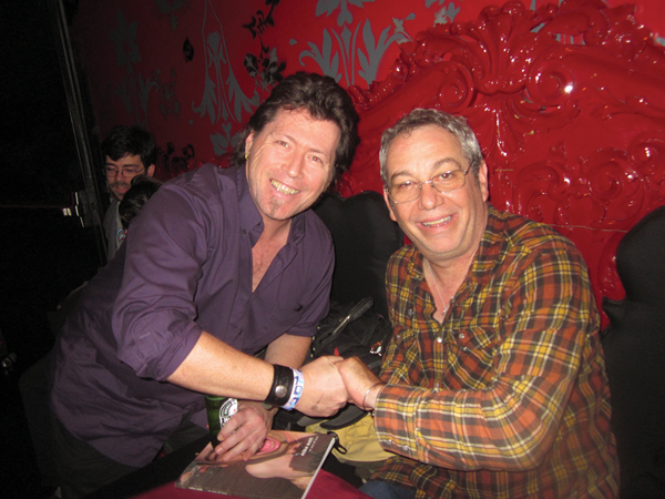 Bassist Mike Watt (right) at the book release party for his collection of poetry and photographs (“On and Off Bass”). At left, poet David Lawton.   Photo by Puma Perl