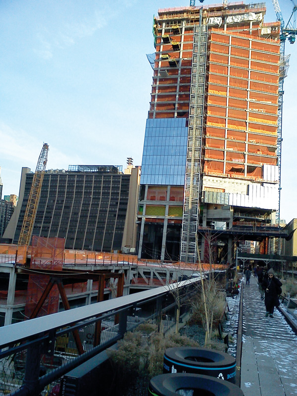 Photo by Scott Stiffler The recently opened final section of the High Line connects pedestrians to 10 Hudson Yards (seen here, under construction).