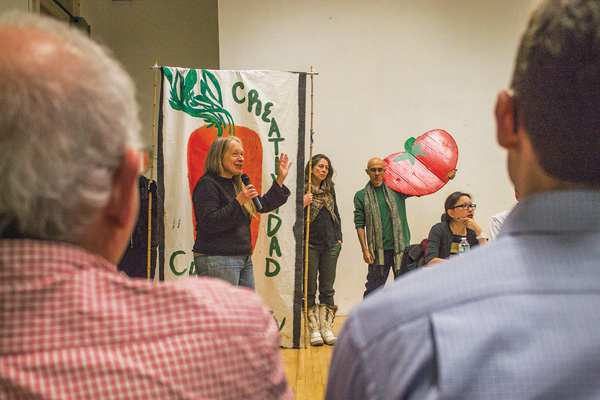 Susan Howard spoke in favor of the district plan at the C.B. 3 meeting, as fellow garden activists Elizabeth-Ruf Maldonado and Aresh Javadi stood beside her and Gigi Li, C.B. 3 chairperson, listened, at far right.