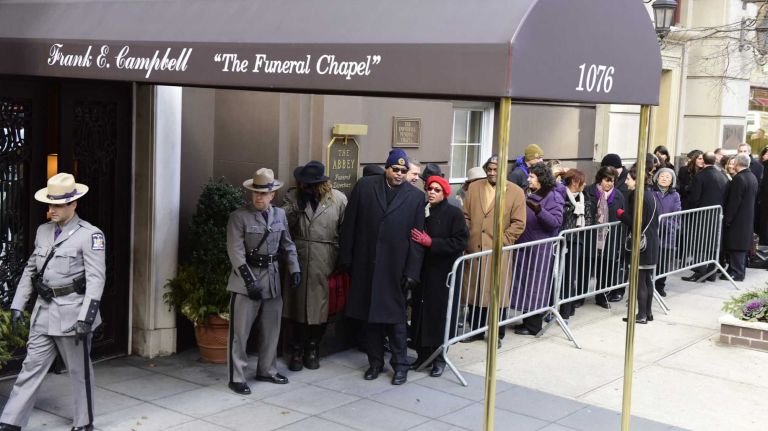 Mourners arrive at Frank E. Campbell Funeral Home in Manhattan before the wake for former Gov. Mario M. Cuomo on Monday, Jan. 5, 2015.