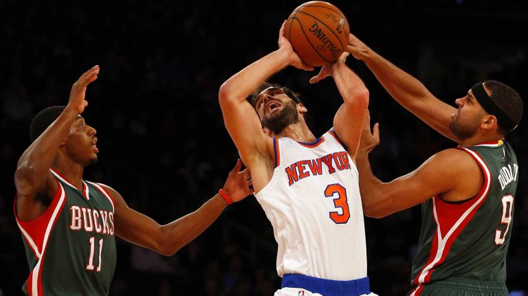 Jose Calderon #3 of the New York Knicks loses the ball between against Brandon Knight #11 and Jared Dudley #9 of the Milwaukee Bucks at Madison Square Garden on Sunday, Jan. 4, 2015.