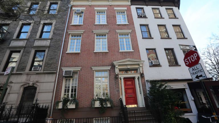 Report: Manhattan home sales prices burning up 2 Houses along Waverly Place near Christopher Street in the West Village.