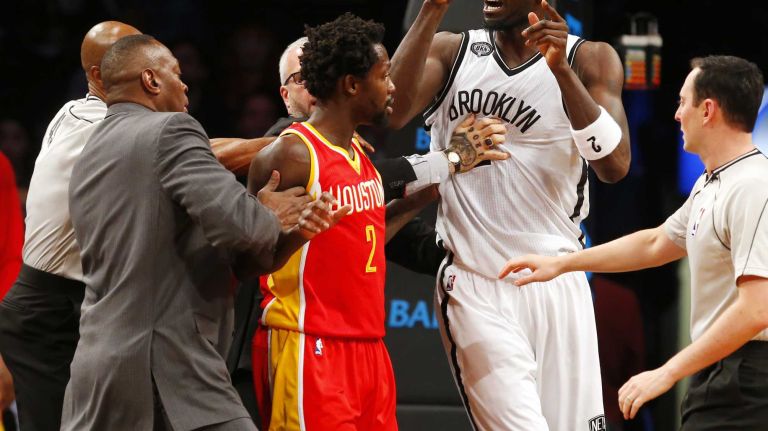 Kevin Garnett #2 of the Brooklyn Nets is held back by Patrick Beverley #2 of the Houston Rockets as he reacts after a first-quarter confrontation with Dwight Howard #12 (not pictured) at Barclays Center on Monday, Jan. 12, 2015.