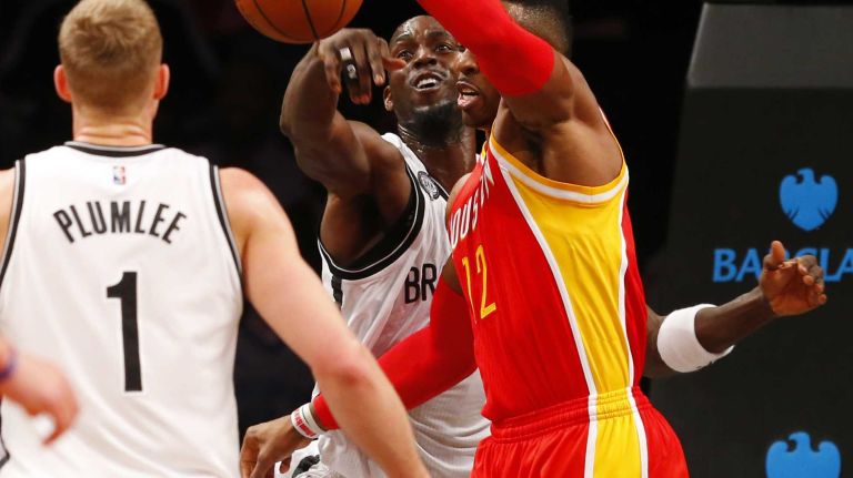 Kevin Garnett #2 of the Brooklyn Nets reaches for the ball in the first quarter against Dwight Howard #12 of the Houston Rockets at Barclays Center on Monday, Jan. 12, 2015.