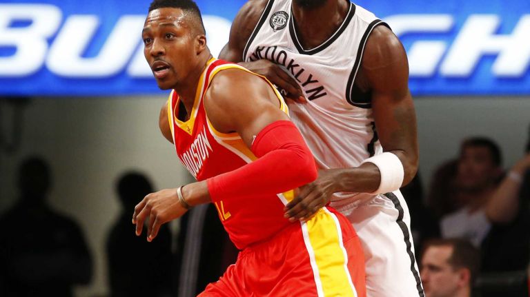 Kevin Garnett #2 of the Brooklyn Nets battles for position in the first quarter against Dwight Howard #12 of the Houston Rockets at Barclays Center on Monday, Jan. 12, 2015.