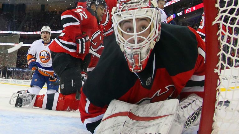 Keith Kinkaid of the New Jersey Devils looks back into the net during the second period against the New York Islanders at the Prudential Center on Jan. 9, 2015 in Newark, N.J.