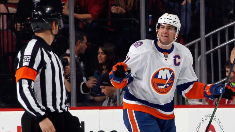 John Tavares of the New York Islanders argues a second-period penalty call with referee Ghislain Hebert during the game against the New Jersey Devils at the Prudential Center on Jan. 9, 2015 in Newark, N.J.