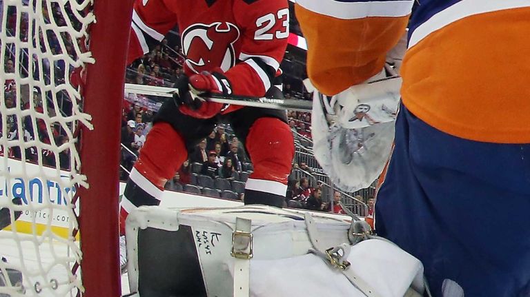 Mike Cammalleri of the New Jersey Devils skates in on Jaroslav Halak of the New York Islanders during the first period at the Prudential Center on Jan. 9, 2015 in Newark, N.J.