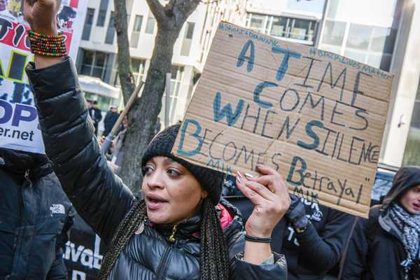 Before Monday’s march on MLK Day, protesters for police reform gathered last Friday at the African Burial Ground on Duane St.    PhotoS by Milo Hess