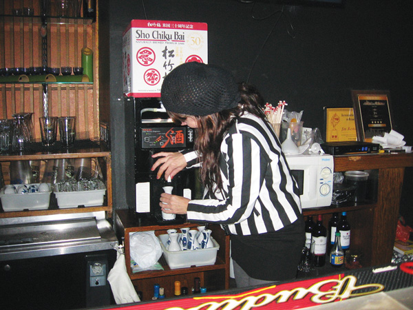The Valentine’s Adventures of an Underemployed Urban Elf 2 Rev. Jen, workin’ the sake machine at Jin. Photo by John Thomas Foster