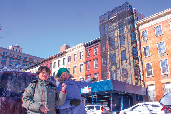 Photo by Zach Williams L to R: Fern Luskin and Julie Finch have battled Tony Mamounas, owner of the Hopper-Gibbons House, for years regarding a fifth story addition protruding above an historic roofline.