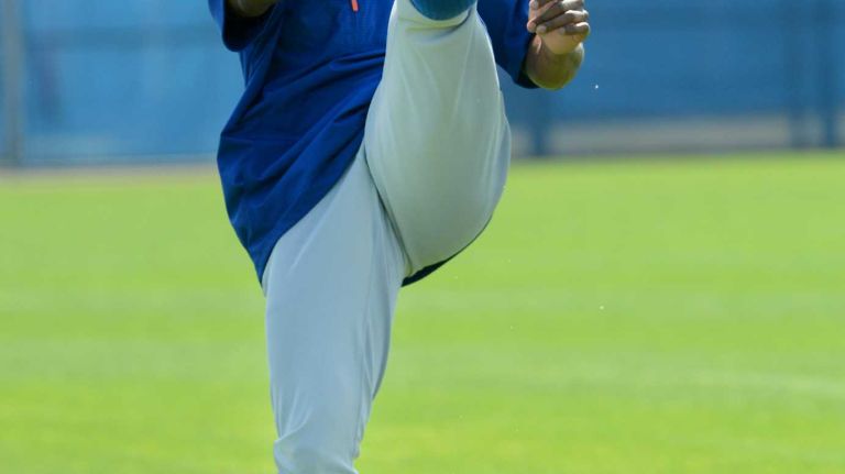 NY Mets outfielder Curtis Granderson warming up during a spring training workout Tuesday Feb 24, 2015.
