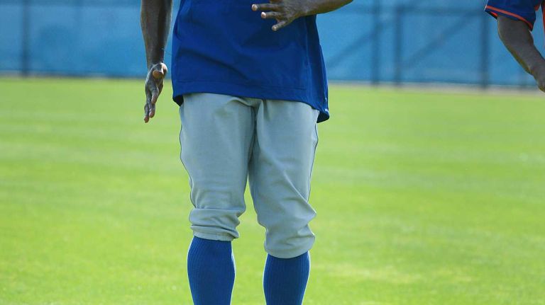 NY Mets outfielder Curtis Granderson warming up during a spring training workout Tuesday Feb 24, 2015.