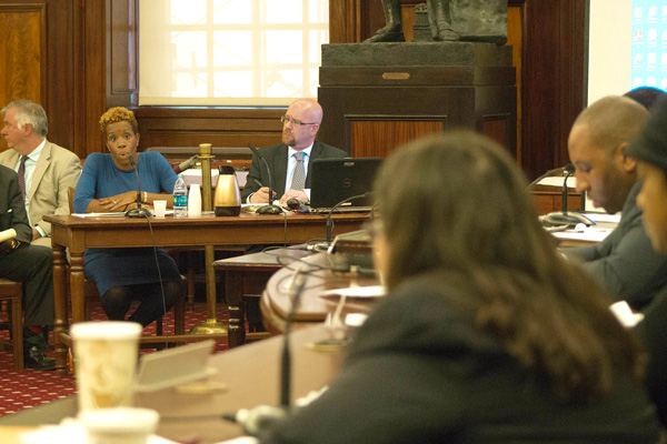 NYCHA Chairperson Shola Olatoye, at left, answering questions from Councilmember Rosie Mendez, in foreground, at Tuesday’s City Council hearing, at which the deal bringing private developers into Campos Plaza I was discussed.  Photo by Zach Williams