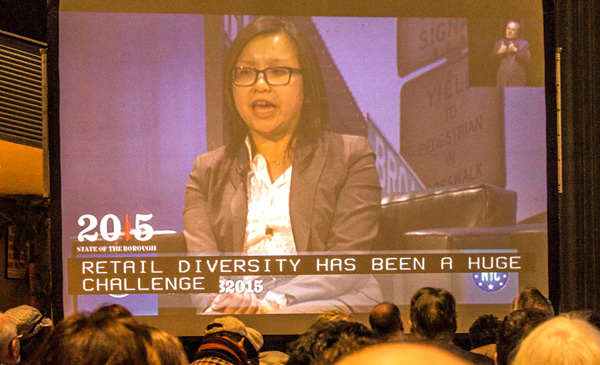 Gigi Li was shown on a big screen as she discussed saving retail diversity at Gale Brewer’s State of the Borough panel event.  Photo by Zach Williams