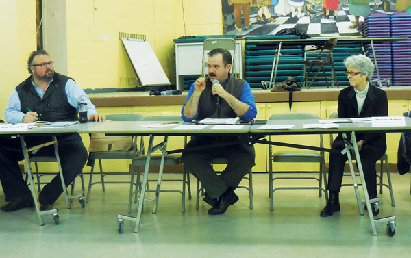 CB4 Tackles Full Agenda in Short Order 4 Photo by Eileen Stukane Jesse Bodine, center, giving the CB4 district manager’s report.