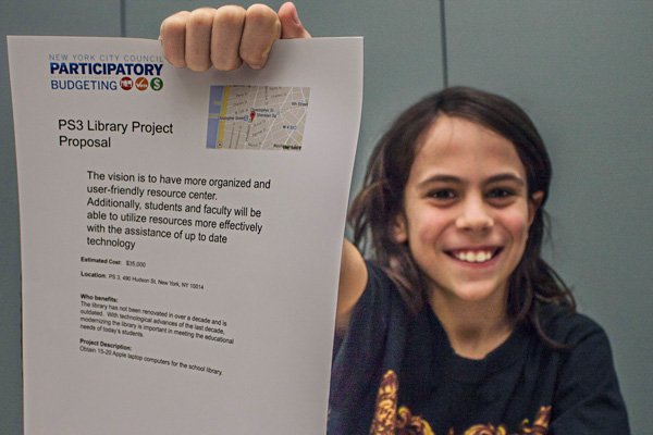 Projects Vie at Participatory Budgeting Expo 2 Photo by Zach Williams Aidan Collins, 10, stepped into the role of point man for the proposal to renovate the library at PS3 — item #6 on your Participatory Budgeting ballot.