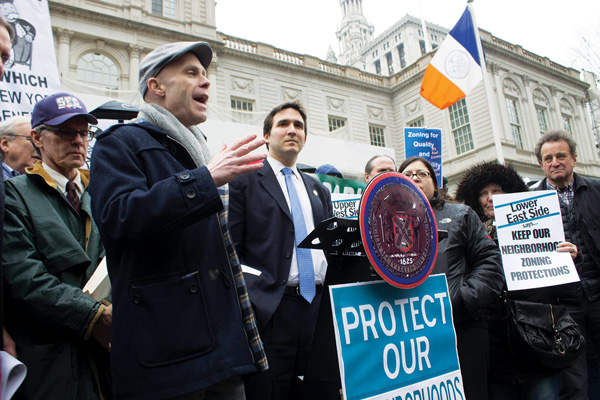 Photo by Zach Williams Dozens gathered on the steps of City Hall on March 25, including Andrew Berman (above speaking to crowd), executive director of the Greenwich Village Society for Historic Preservation.