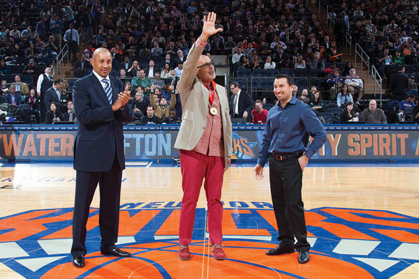 From left, John Starks, Antonio Aponte and Anthony Goenaga as the City Spirit Award was given to Aponte at center court at Madison Square Garden. Goenaga was part of Aponte’s Latino College Expo program and is now the Knicks’ associate athletic trainer.