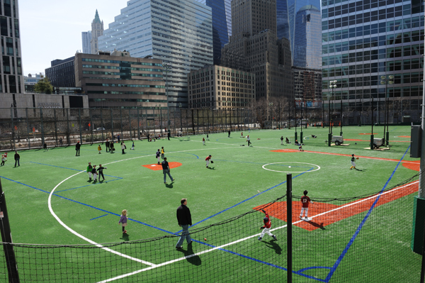 Players warmed up on the Battery Park City ball fields on the first day of the 2013 Downtown Little League season. Eight games were played on the fields on opening day. Downtown Express file photo by Terese Loeb Kreuzer