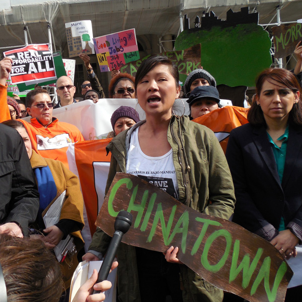 Cathy Dang, of CAAAV Organizing Asian Communities, spoke at a City Hall rally after the bad news on the proposal.   Photo by Gerard Flynn