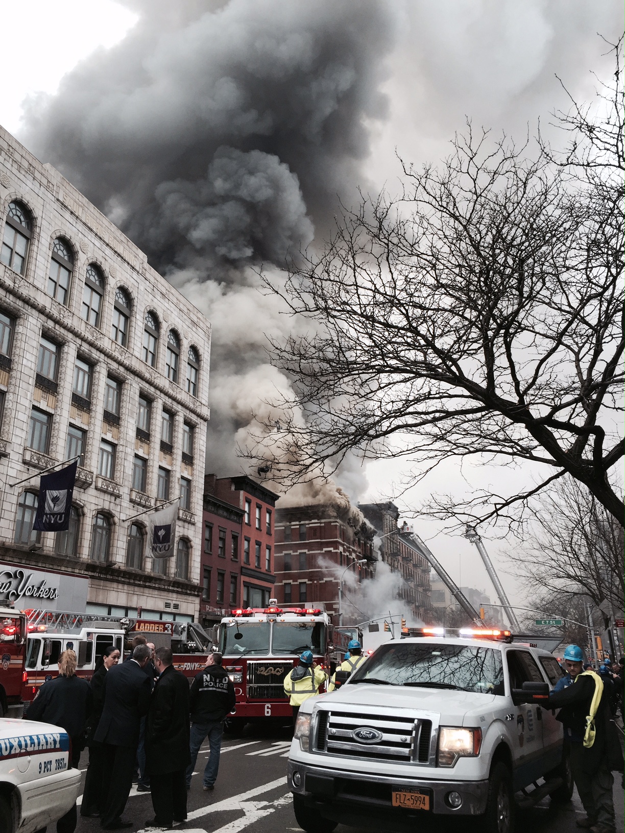 Firefighters flooded E. Seventh St. and Second Ave. after an explosion caused a partial building collapse and fire.  Photo by Tequila Minsky