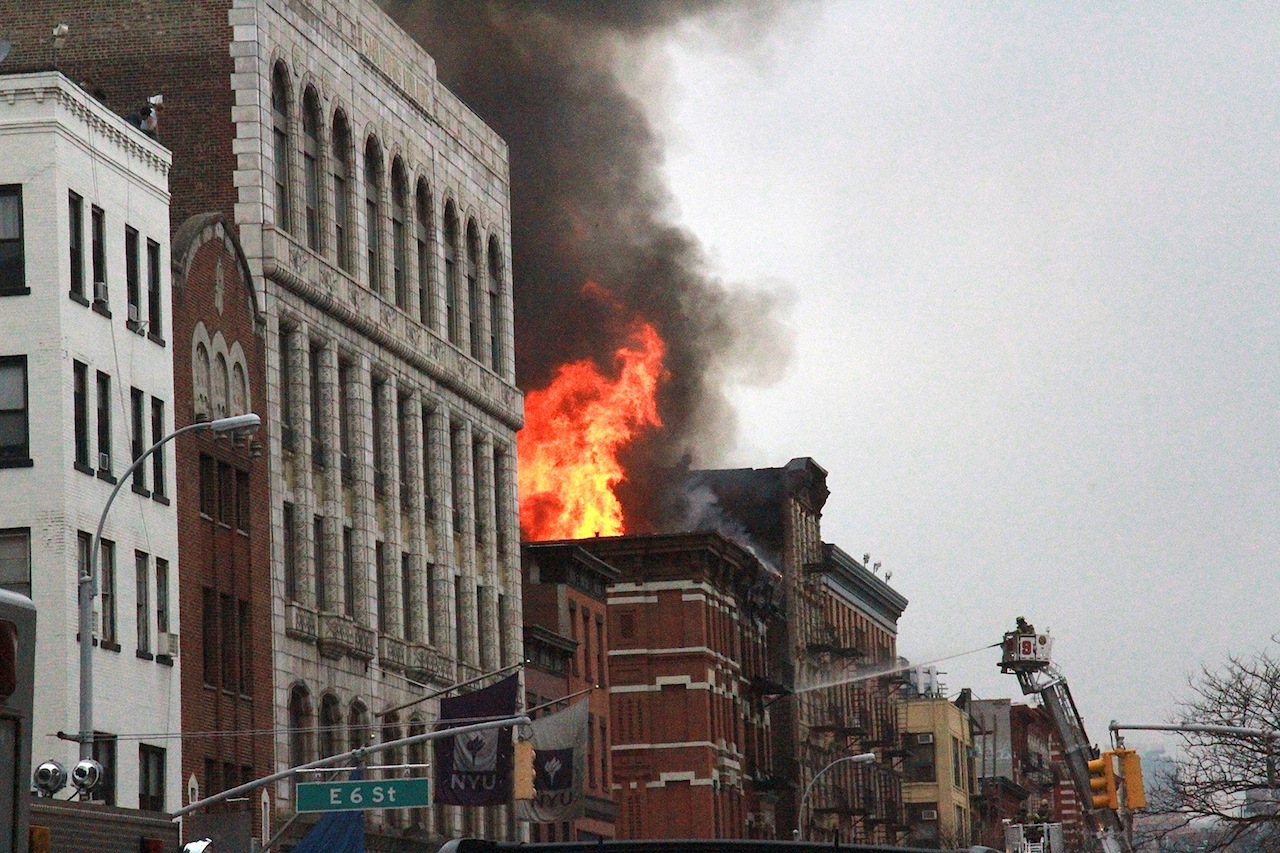 Firefighters attacked the raging blaze from a bucket ladder on Second Ave.