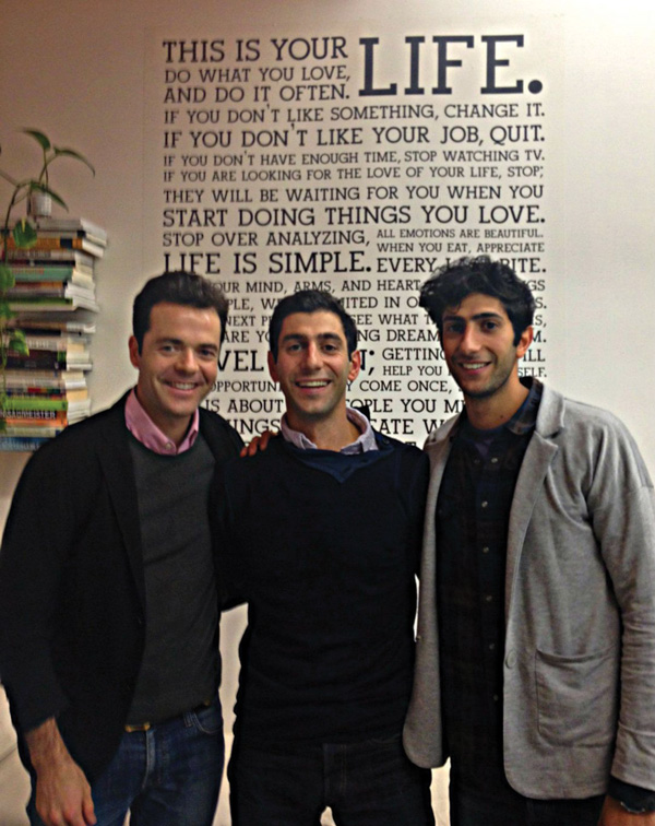 Holstee co-founders, from left, Fabian Pfortmüller, Michael Radparvar and Dave Radparvar in front of the Holstee Manifesto, a poster of motivational sayings.