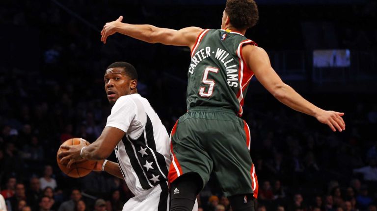 Joe Johnson of the Brooklyn Nets controls the ball against Michael Carter-Williams of the Milwaukee Bucks at Barclays Center on Friday, March 20, 2015.