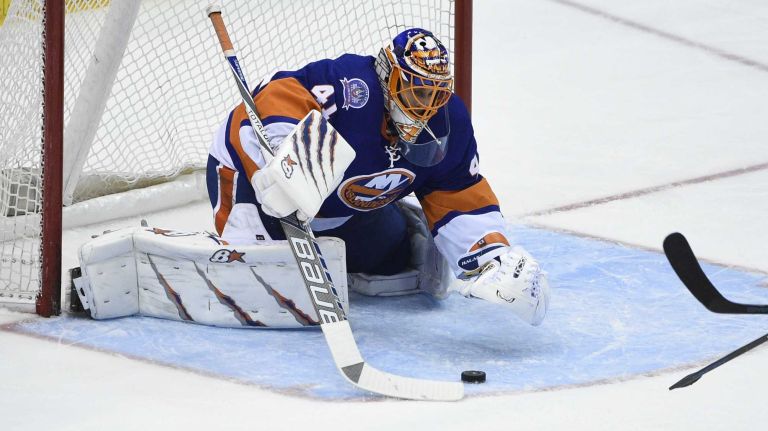 New York Islanders goalie Jaroslav Halak makes a save against the Los Angeles Kings in the second period of an NHL hockey game at Nassau Coliseum on Thursday, March 26, 2015.