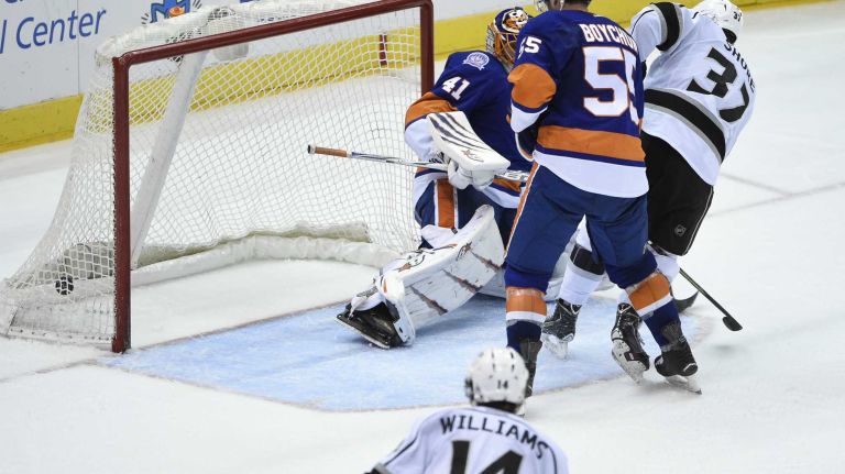 Los Angeles Kings center Nick Shore scores on New York Islanders goalie Jaroslav Halak in the second period of an NHL hockey game at Nassau Coliseum on Thursday, March 26, 2015.
