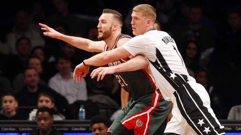 Mason Plumlee of the Brooklyn Nets defends against Miles Plumlee of the Milwaukee Bucks during the first half at Barclays Center on Friday, March 20, 2015.