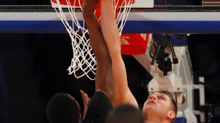 Lance Thomas #42 of the New York Knicks blocks a shot in the first half against Andrew Wiggins #22 of the Minnesota Timberwolves at Madison Square Garden on Thursday, March 19, 2015.